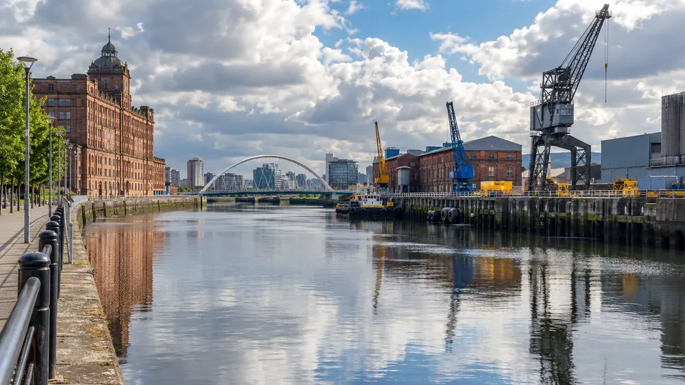 River Clyde with Glasgow commercial buildings and industrial waterfront